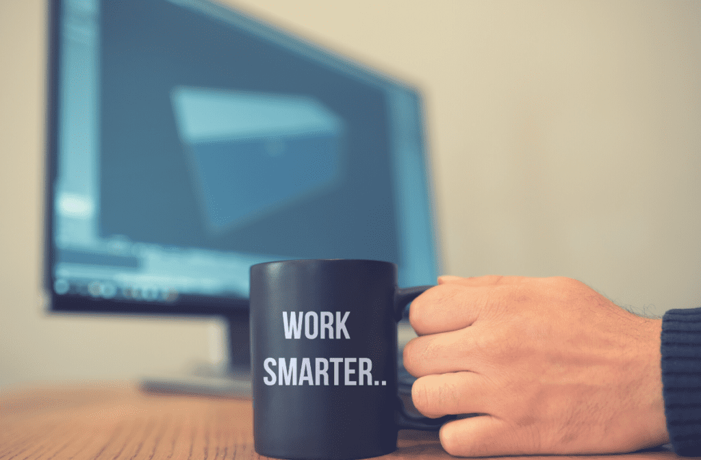 A person holding a coffee mug with the words " work smarter ".