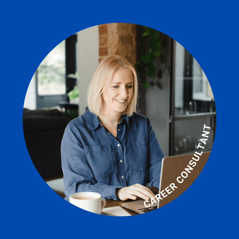 A woman sitting at a table with a laptop.