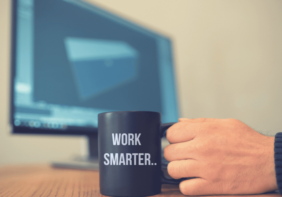 A person holding a coffee mug with the words " work smarter ".